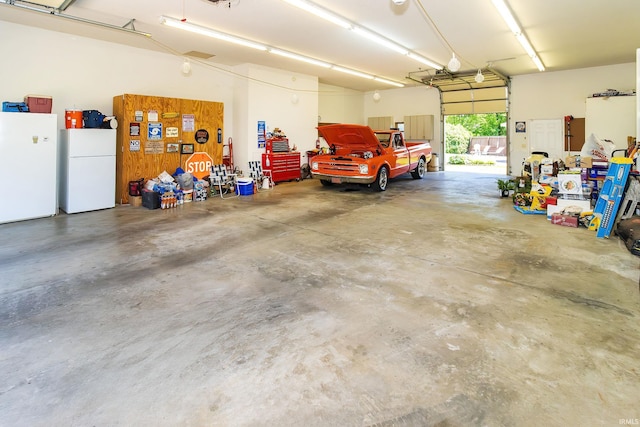 509 Mount Ashley Rd, Evansville, IN 47711 - garage featuring freestanding refrigerator