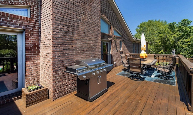 509 Mount Ashley Rd, Evansville, IN 47711 - wooden terrace with outdoor dining space, grilling area, and an outdoor fire pit