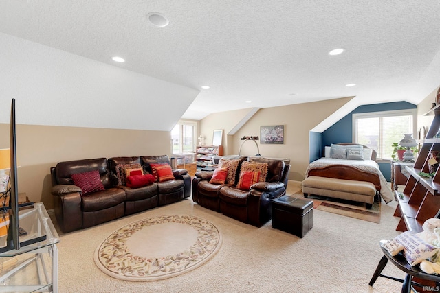 carpeted living room featuring lofted ceiling, healthy amount of natural light, a textured ceiling, and recessed lighting