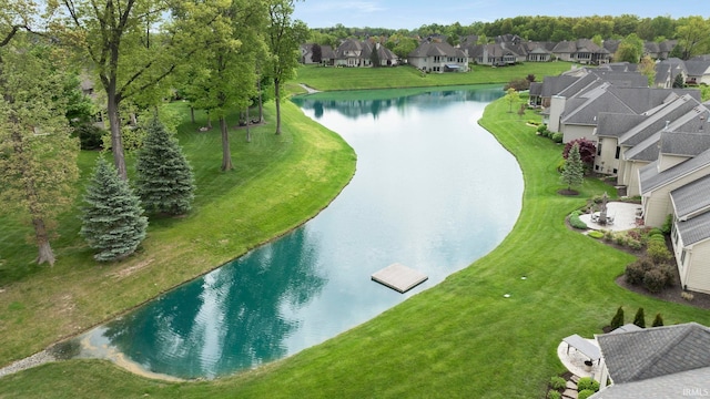 aerial view of residential area featuring a nearby body of water