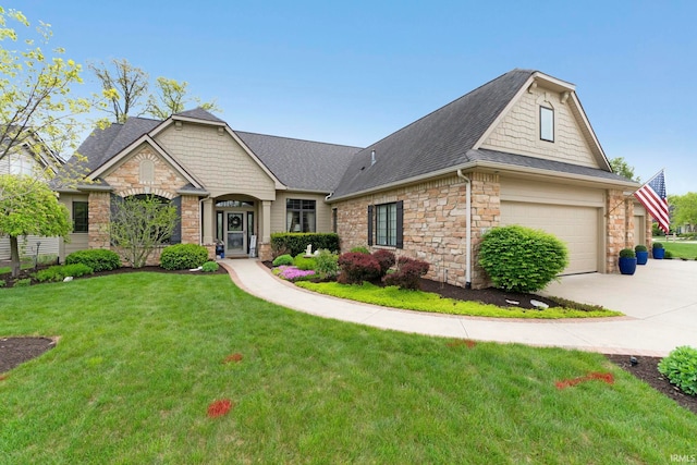 view of front of home featuring stone siding, concrete driveway, a front yard, and roof with shingles