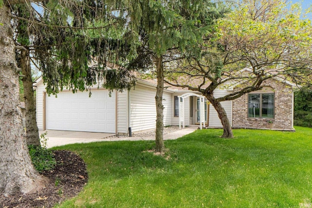 6114 Picacho Dr, Fort Wayne, IN 46825 - view of front of property with a front yard, a garage, and driveway