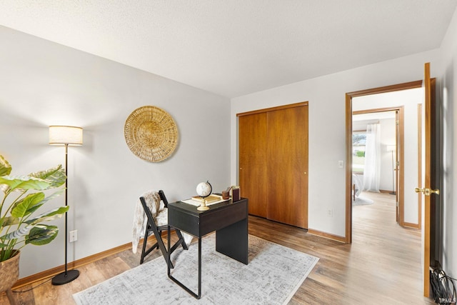 6114 Picacho Dr, Fort Wayne, IN 46825 - home office with baseboards and light wood-style flooring