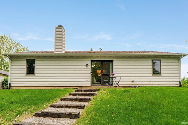 6114 Picacho Dr, Fort Wayne, IN 46825 - rear view of property with a yard and a chimney