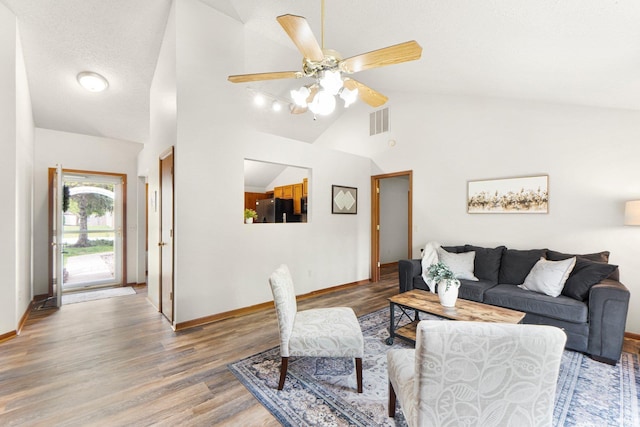 6114 Picacho Dr, Fort Wayne, IN 46825 - living room with baseboards, ceiling fan, wood finished floors, and high vaulted ceiling