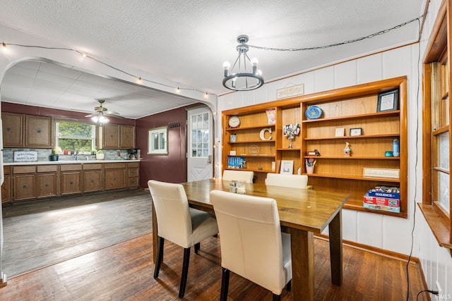 260 N 850 W-92 Rd, Pierceton, IN 46562 - dining room with dark wood-style floors, a chandelier, a textured ceiling, rail lighting, and ceiling fan