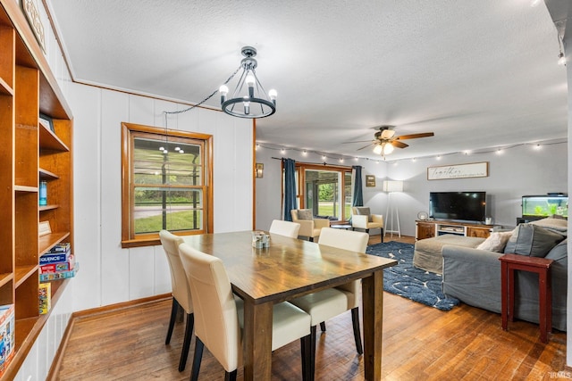 260 N 850 W-92 Rd, Pierceton, IN 46562 - dining room featuring wood-type flooring, a chandelier, ceiling fan, and a textured ceiling