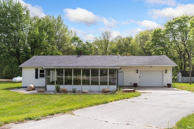260 N 850 W-92 Rd, Pierceton, IN 46562 - ranch-style home with a sunroom, a garage, driveway, a storage shed, and a front yard