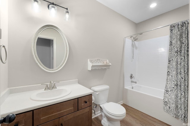 1004 Hathaway Rd, Fort Wayne, IN 46845 - full bathroom featuring wood finished floors, toilet, vanity, shower / bath combination with curtain, and baseboards