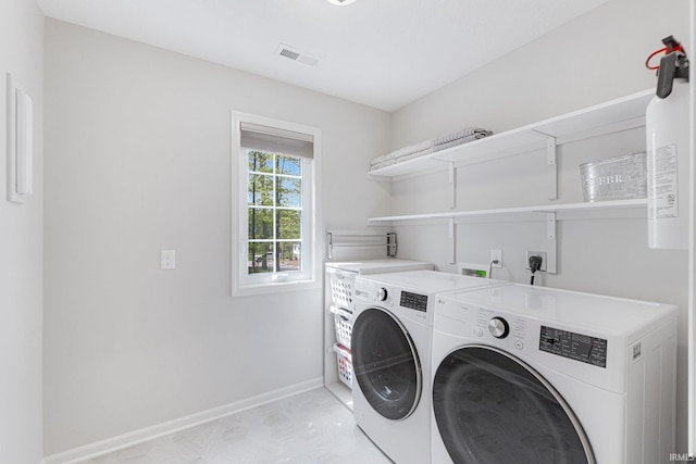 1004 Hathaway Rd, Fort Wayne, IN 46845 - laundry room featuring washing machine and clothes dryer and baseboards