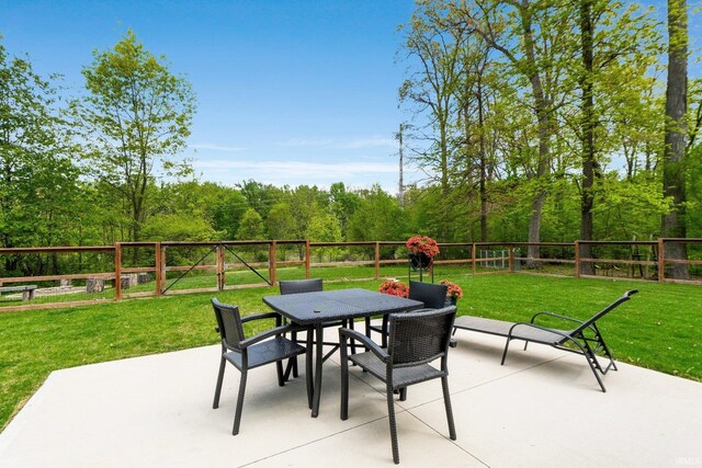 1004 Hathaway Rd, Fort Wayne, IN 46845 - view of patio / terrace featuring outdoor dining space and a view of trees