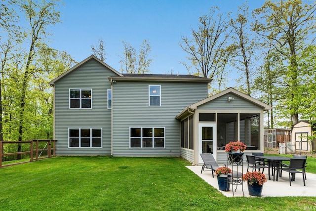 1004 Hathaway Rd, Fort Wayne, IN 46845 - back of property featuring a sunroom, a patio area, a storage shed, and an outbuilding