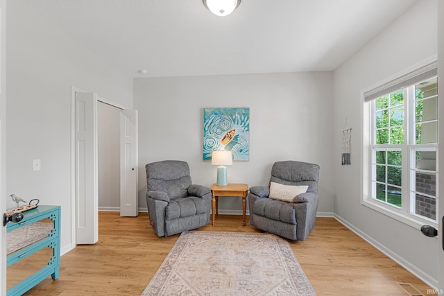 1004 Hathaway Rd, Fort Wayne, IN 46845 - living area with light wood-style flooring and baseboards