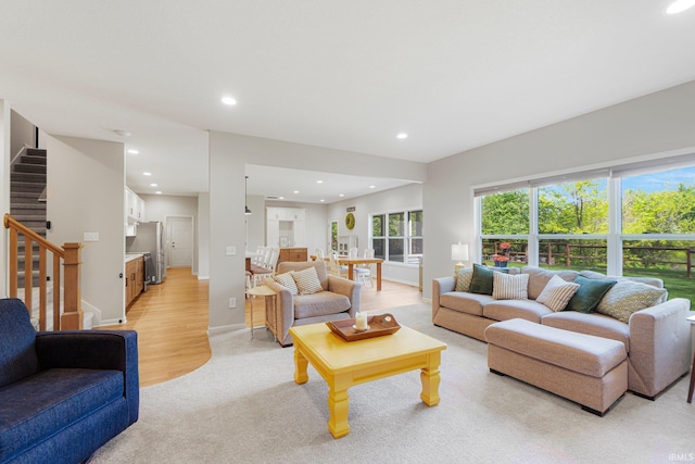 1004 Hathaway Rd, Fort Wayne, IN 46845 - living area featuring stairway, recessed lighting, light colored carpet, and baseboards
