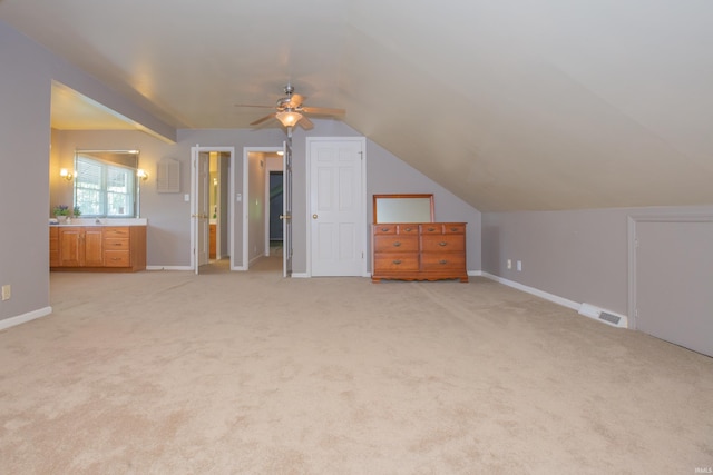 300 Springhaven Dr, Evansville, IN 47710 - additional living space with a ceiling fan, light carpet, vaulted ceiling, and baseboards