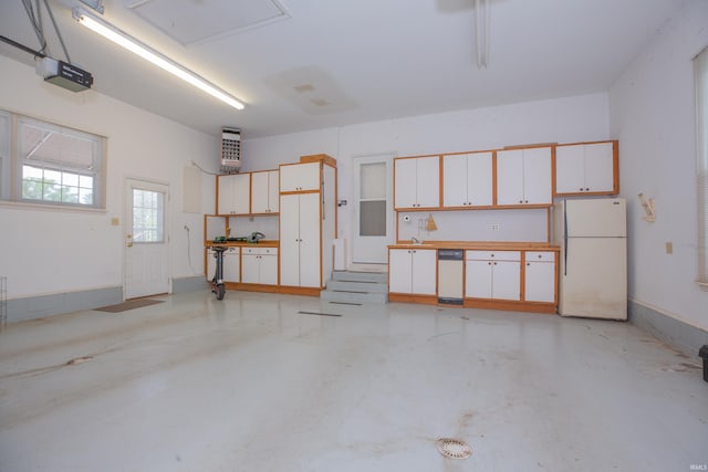 300 Springhaven Dr, Evansville, IN 47710 - garage with freestanding refrigerator and a sink