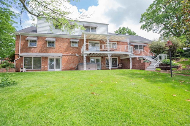 300 Springhaven Dr, Evansville, IN 47710 - rear view of property featuring brick siding, stairway, a lawn, and a wooden deck