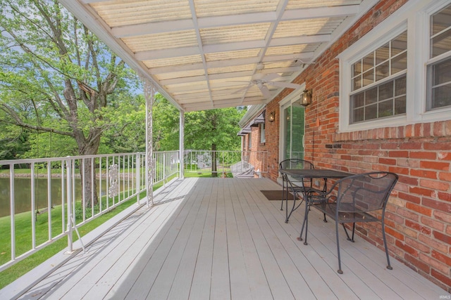 300 Springhaven Dr, Evansville, IN 47710 - wooden terrace with a water view, ceiling fan, and view of wooded area