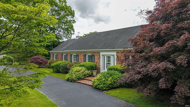 300 Springhaven Dr, Evansville, IN 47710 - cape cod house with brick siding and roof with shingles
