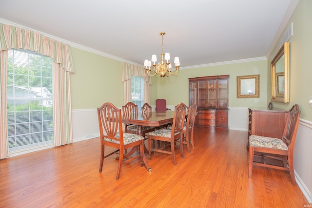 300 Springhaven Dr, Evansville, IN 47710 - dining room with a chandelier, light wood-style flooring, crown molding, and baseboards