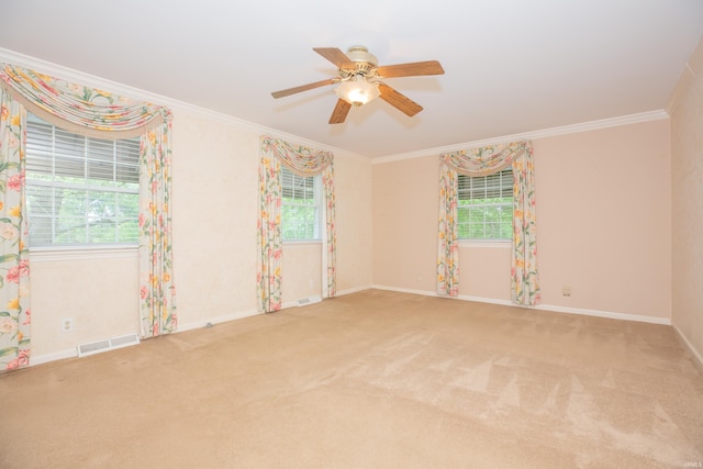 300 Springhaven Dr, Evansville, IN 47710 - empty room featuring healthy amount of natural light, ornamental molding, a ceiling fan, carpet, and baseboards