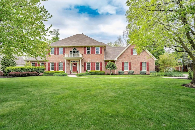 10528 Indian Ridge Dr, Fort Wayne, IN 46814 - colonial home with brick siding, a front lawn, and roof with shingles