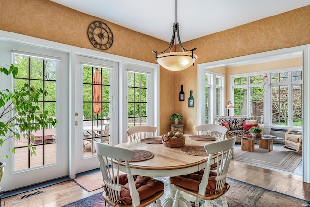 10528 Indian Ridge Dr, Fort Wayne, IN 46814 - dining room with wallpapered walls and light wood-style flooring