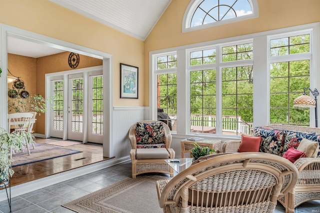 10528 Indian Ridge Dr, Fort Wayne, IN 46814 - sunroom / solarium featuring french doors, a wainscoted wall, tile patterned floors, and high vaulted ceiling