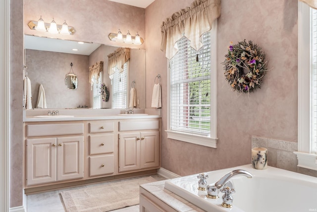 10528 Indian Ridge Dr, Fort Wayne, IN 46814 - full bathroom with double vanity, a garden tub, and baseboards