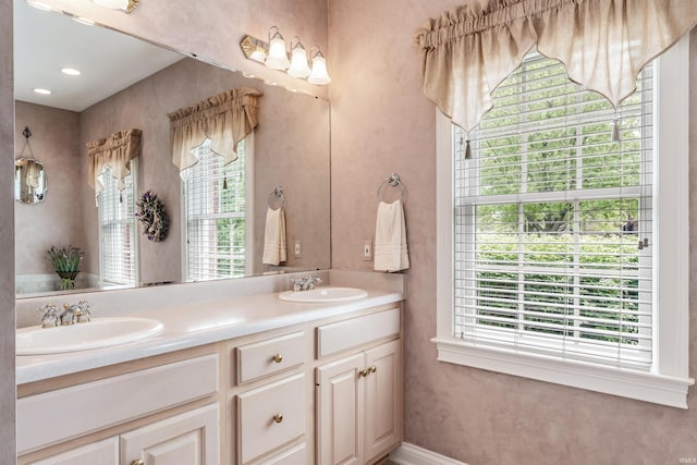 10528 Indian Ridge Dr, Fort Wayne, IN 46814 - bathroom featuring double vanity and baseboards