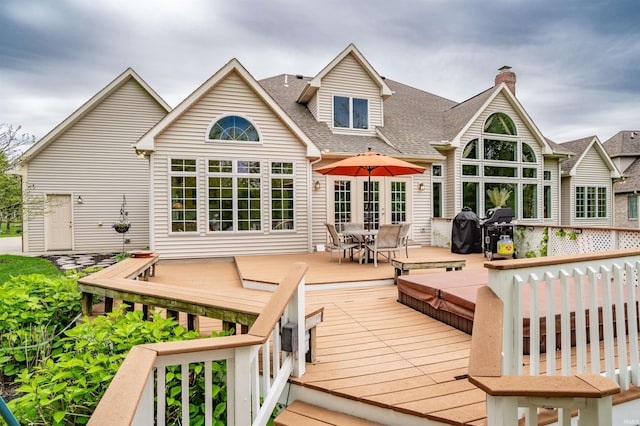10528 Indian Ridge Dr, Fort Wayne, IN 46814 - back of property with outdoor dining area, roof with shingles, a wooden deck, and a chimney