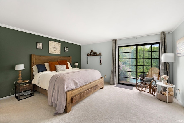bedroom featuring ornamental molding, carpet, and access to exterior