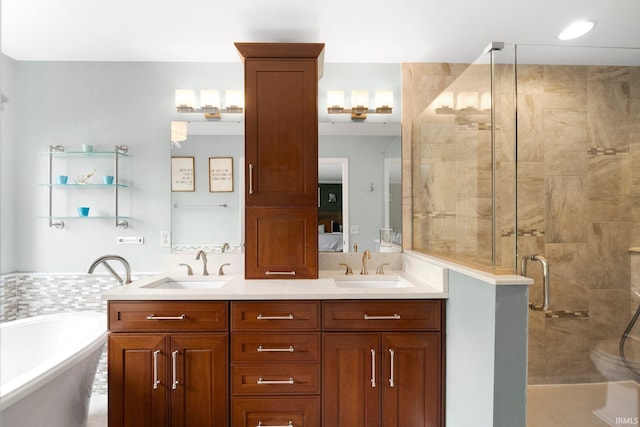 full bathroom featuring a freestanding tub, a shower stall, and double vanity