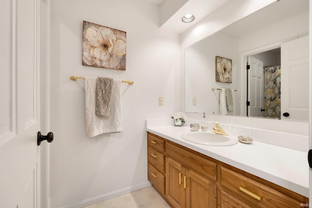 bathroom with vanity and baseboards