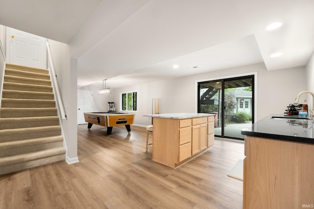 kitchen featuring a sink, light brown cabinetry, light wood finished floors, pool table, and recessed lighting
