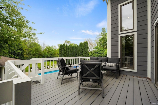 wooden terrace featuring an outdoor living space