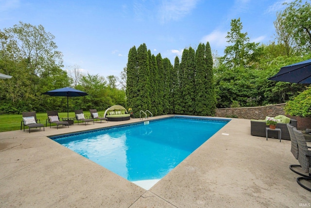 swimming pool featuring a patio