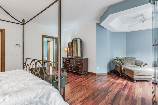 bedroom with wood finished floors, baseboards, and ceiling fan