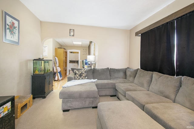 213 E Fourth St, Milford, IN 46542 - living area featuring arched walkways and light carpet