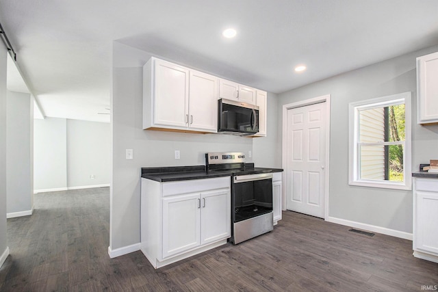 10059 Jefferson Rd, Osceola, IN 46561 - kitchen with stainless steel appliances, dark wood-type flooring, baseboards, white cabinets, and recessed lighting