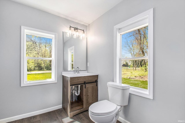 10059 Jefferson Rd, Osceola, IN 46561 - half bathroom with baseboards, wood finished floors, and healthy amount of natural light