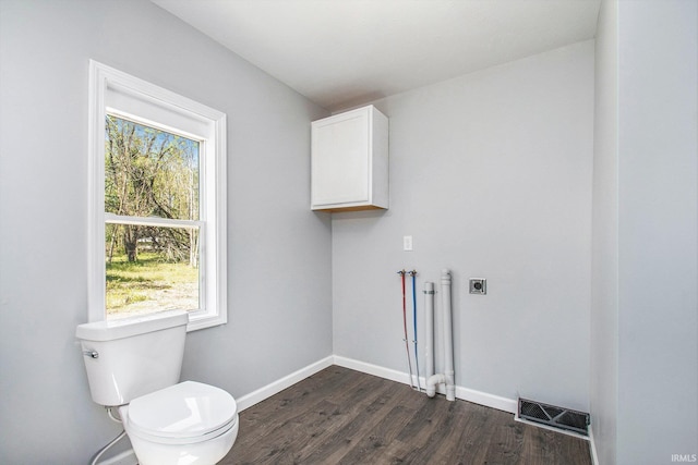 10059 Jefferson Rd, Osceola, IN 46561 - clothes washing area with hookup for an electric dryer, dark wood-type flooring, plenty of natural light, and baseboards