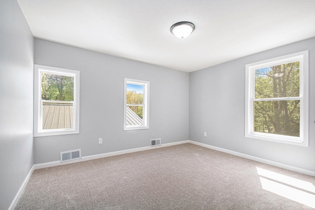 10059 Jefferson Rd, Osceola, IN 46561 - unfurnished room featuring plenty of natural light, carpet floors, and baseboards