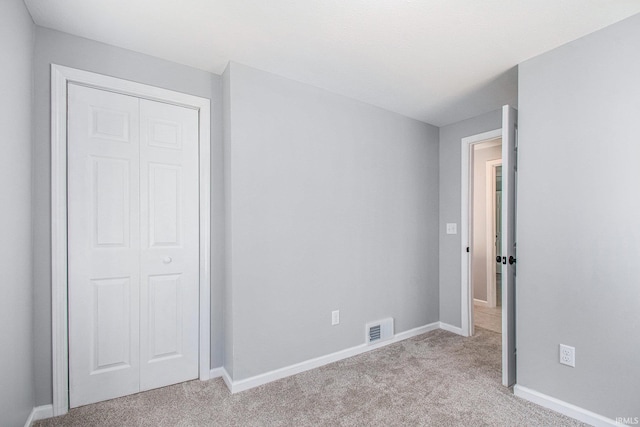 10059 Jefferson Rd, Osceola, IN 46561 - unfurnished bedroom with light carpet, a closet, and baseboards