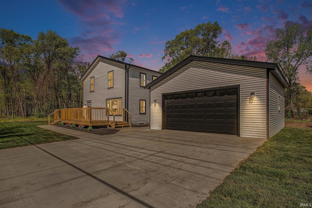 10059 Jefferson Rd, Osceola, IN 46561 - view of front of house with a garage, a deck, a front yard, and driveway