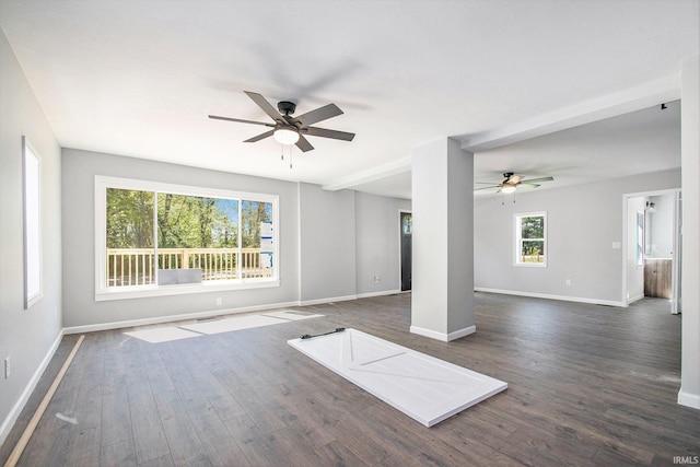 10059 Jefferson Rd, Osceola, IN 46561 - unfurnished living room with a ceiling fan, baseboards, and dark wood-style floors