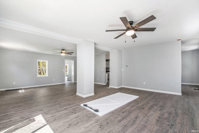 10059 Jefferson Rd, Osceola, IN 46561 - unfurnished living room with ceiling fan, wood finished floors, and baseboards
