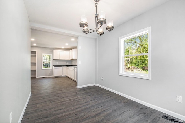 10059 Jefferson Rd, Osceola, IN 46561 - unfurnished dining area with a chandelier, baseboards, dark wood-style flooring, and recessed lighting