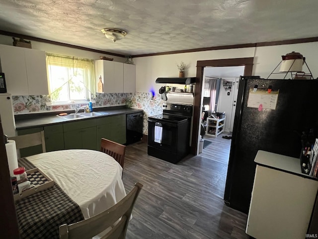 907 S 21st St, Lafayette, IN 47905 - kitchen with black appliances, a sink, dark wood-style flooring, dark countertops, and backsplash