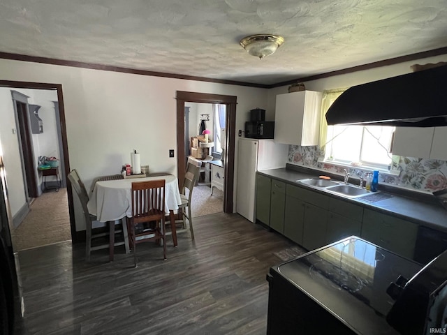 907 S 21st St, Lafayette, IN 47905 - kitchen with a sink, dark wood finished floors, dark countertops, tasteful backsplash, and a textured ceiling